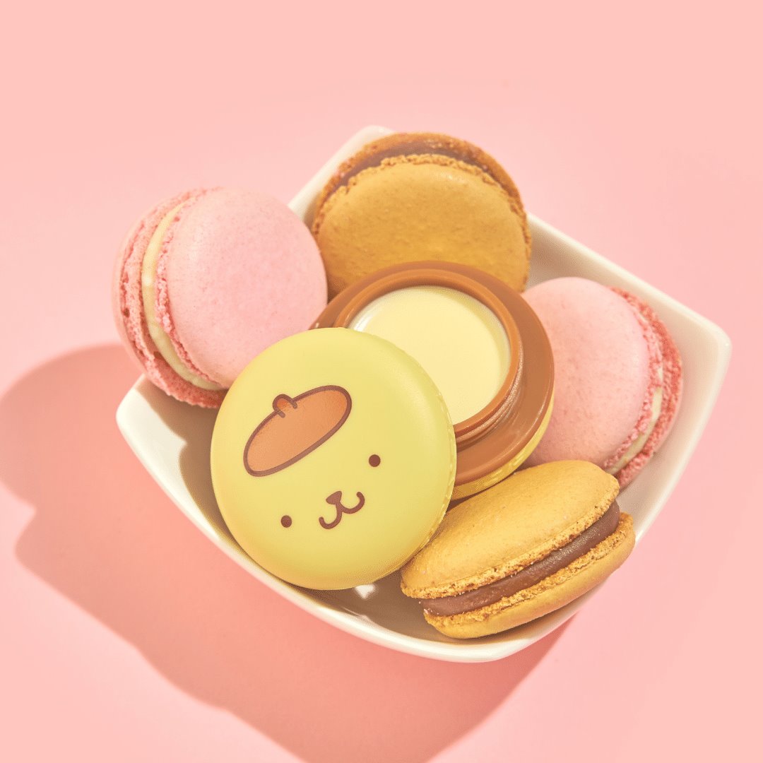The Crème Shop Pompompurin Holiday Macaron Lip Balm - Caramel Pudding